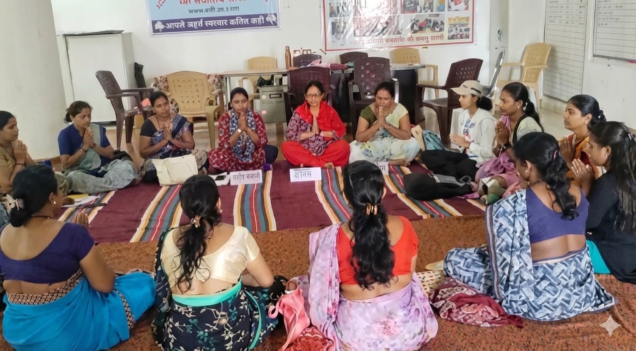 Women gathered in a circle during a community learning session